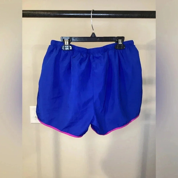 Champion blue running shorts with yellow sides and purple seams. - Picture 2 of 2